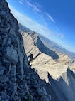 Members of Custer County Search and Rescue hike across Mount Idaho July 18, 2026, to reach an injured hiker.