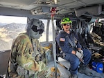 Idaho Army National Guard Staff Sgt. Brad Stock and Boise Fire Department Cpt. Ryan Yates travel to Mount Idaho in a UH-60 Black Hawk to conduct a search and rescue mission on the state's seventh highest peak, July 18, 2026. Courtesy photo.
