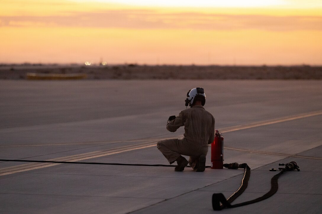 U.S. Marine Corps Lance Cpl. Noah Hiedcavage, from Pennsylvania, a fixed-wing aircraft loadmaster with Marine Aerial Refueler Transport Squadron (VMGR) 252, Marine Aircraft Group 14, 2nd Marine Aircraft Wing, prepares for aviation-delivered ground refueling training during a Marine Corps Combat Readiness Evaluation at Yuma International Airport, Yuma, Arizona, July 16, 2026. Marines with VMGR-252 trained alongside Marine Medium Tiltrotor Squadron (VMM) 266 and elements of the U.S. Air Force to increase expeditionary capabilities, refine aircrew proficiency and ensure combat readiness. (U.S. Marine Corps photo by Lance Cpl. Jacsive Betancourt)