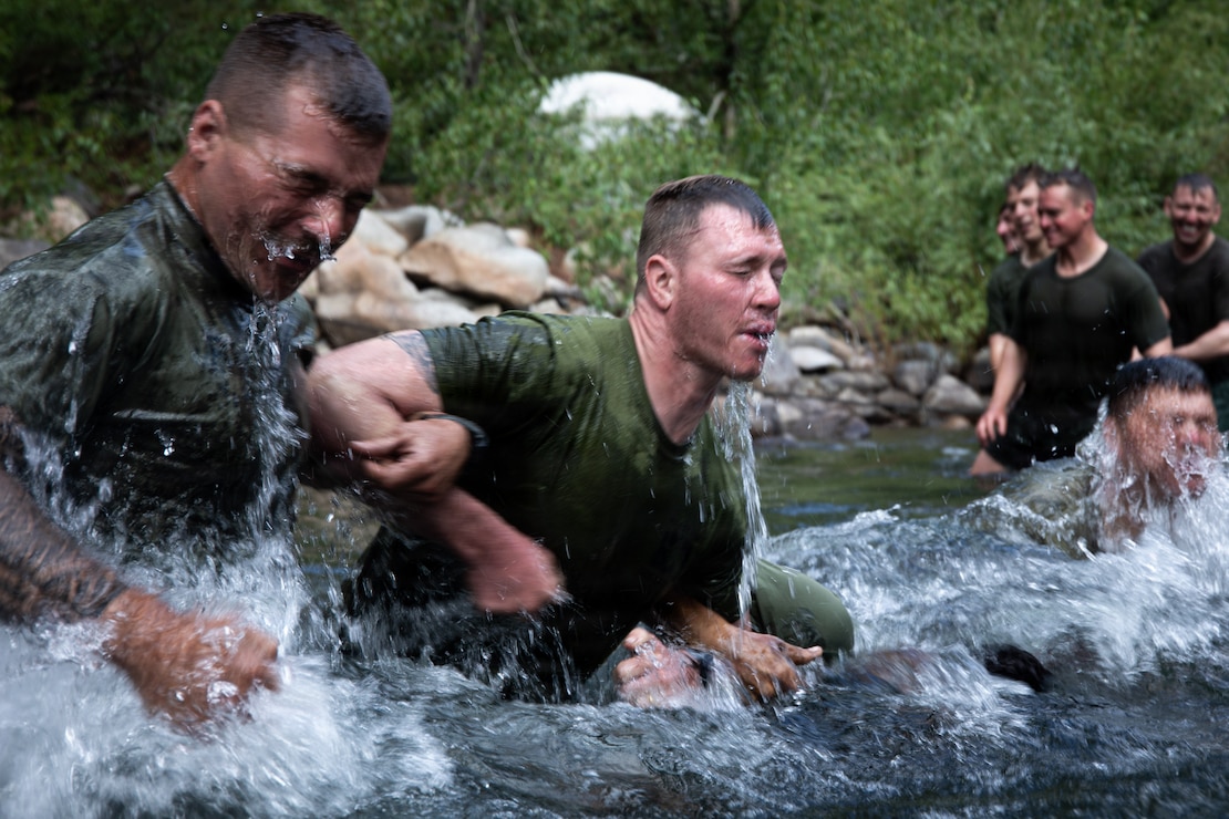 U.S. Marines with 3rd Battalion, 25th Marine Regiment, 4th Marine Division, cross a river during Mountain Training Exercise (MTX) 26-3 at Marine Corps Mountain Warfare Training Center, Bridgeport, California, July 14, 2026. MTX is an annual two-week training evolution that is designed to strengthen unit cohesion and prepare the battalion for rapid mobilization in support of future global operations. (U.S. Marine Corps photo by Cpl. Orion Stpierre)