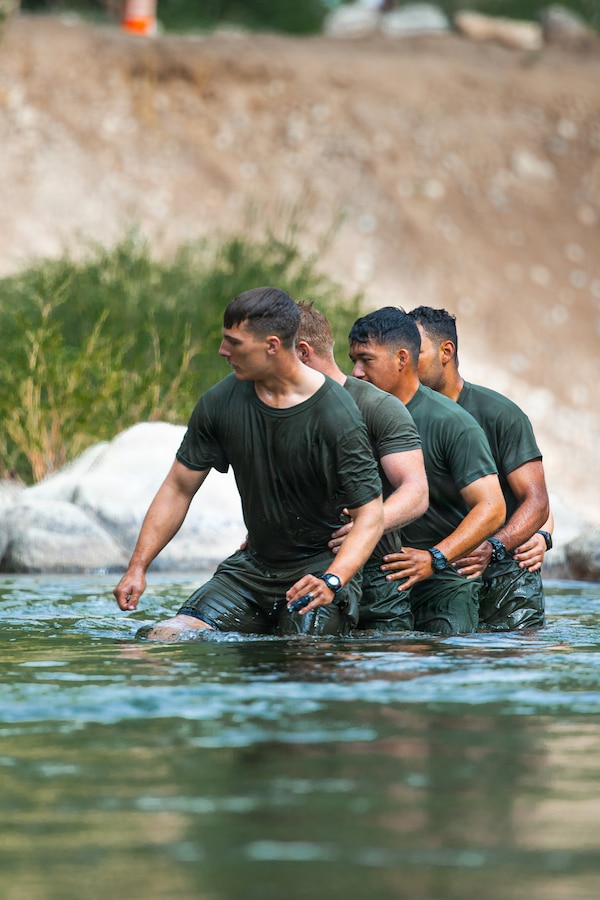 U.S. Marines with 3rd Battalion, 25th Marine Regiment, 4th Marine Division, cross a river during Mountain Training Exercise (MTX) 26-3 at Marine Corps Mountain Warfare Training Center, Bridgeport, California, July 14, 2026. MTX is an annual two-week training evolution that is designed to strengthen unit cohesion and prepare the battalion for rapid mobilization in support of future global operations. (U.S. Marine Corps photo by Cpl. Orion Stpierre)
