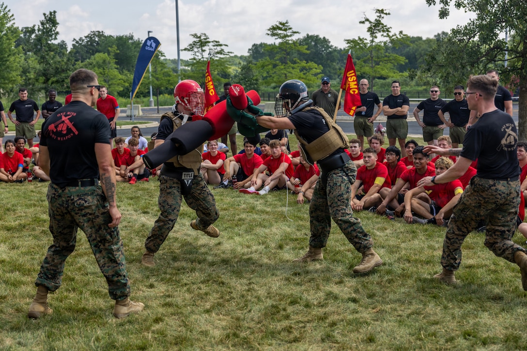 U.S. Marines with Recruiting Station Milwaukee engage in pugil stick fighting during a pool function at the Armed Forces Reserve Center in Madison, Wisconsin, July 18, 2026. During the event, the poolees completed an initial strength test, practiced casualty evacuation, and utilized the Indoor Simulated Marksmanship Trainer and Battle Positions. They also received instruction on common Marine Corps weaponry and practiced drill with drill instructors. (U.S. Marine Corps photo by Cpl. Maxwell Cook)