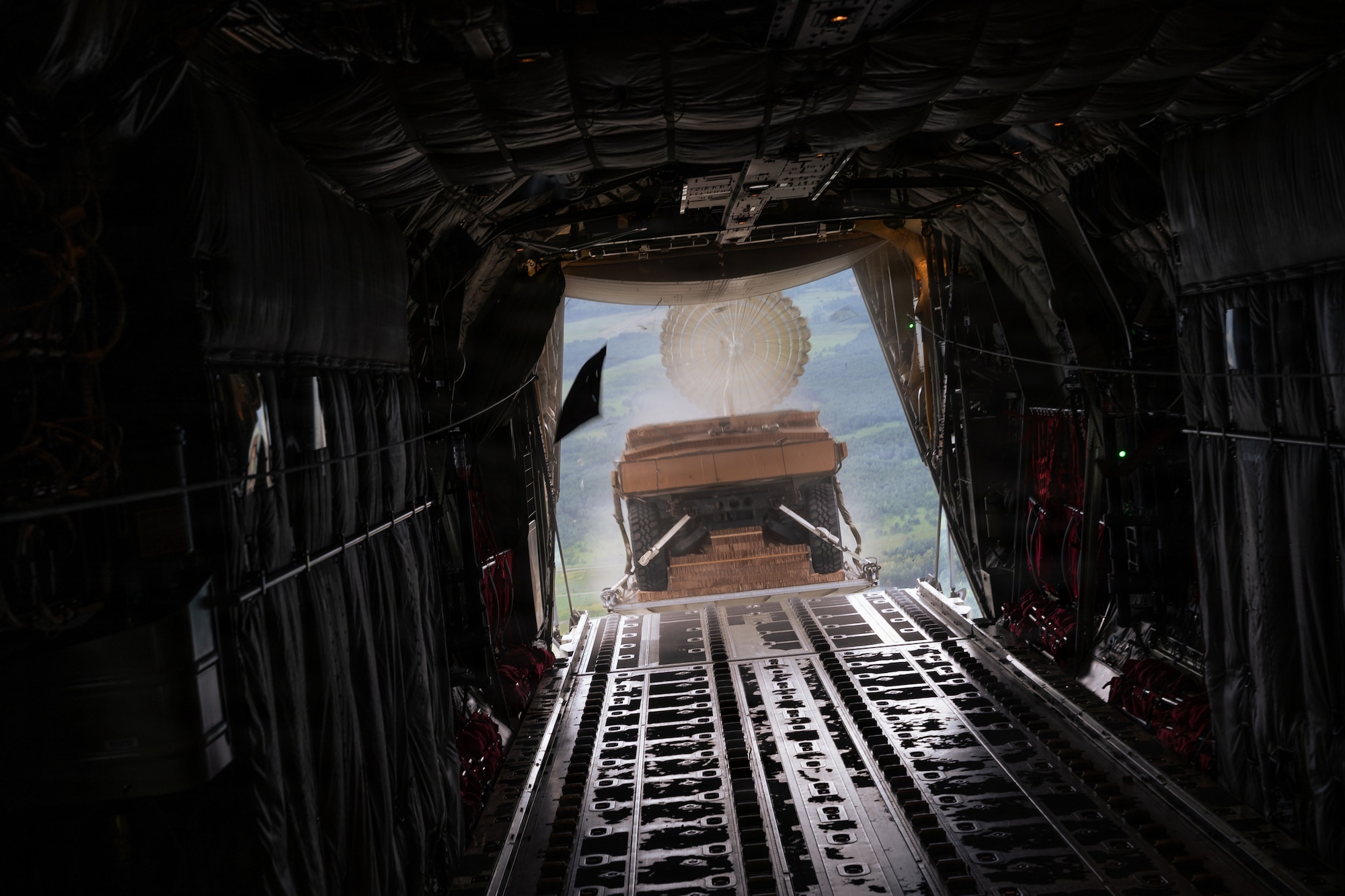 Cargo drops out of a plane