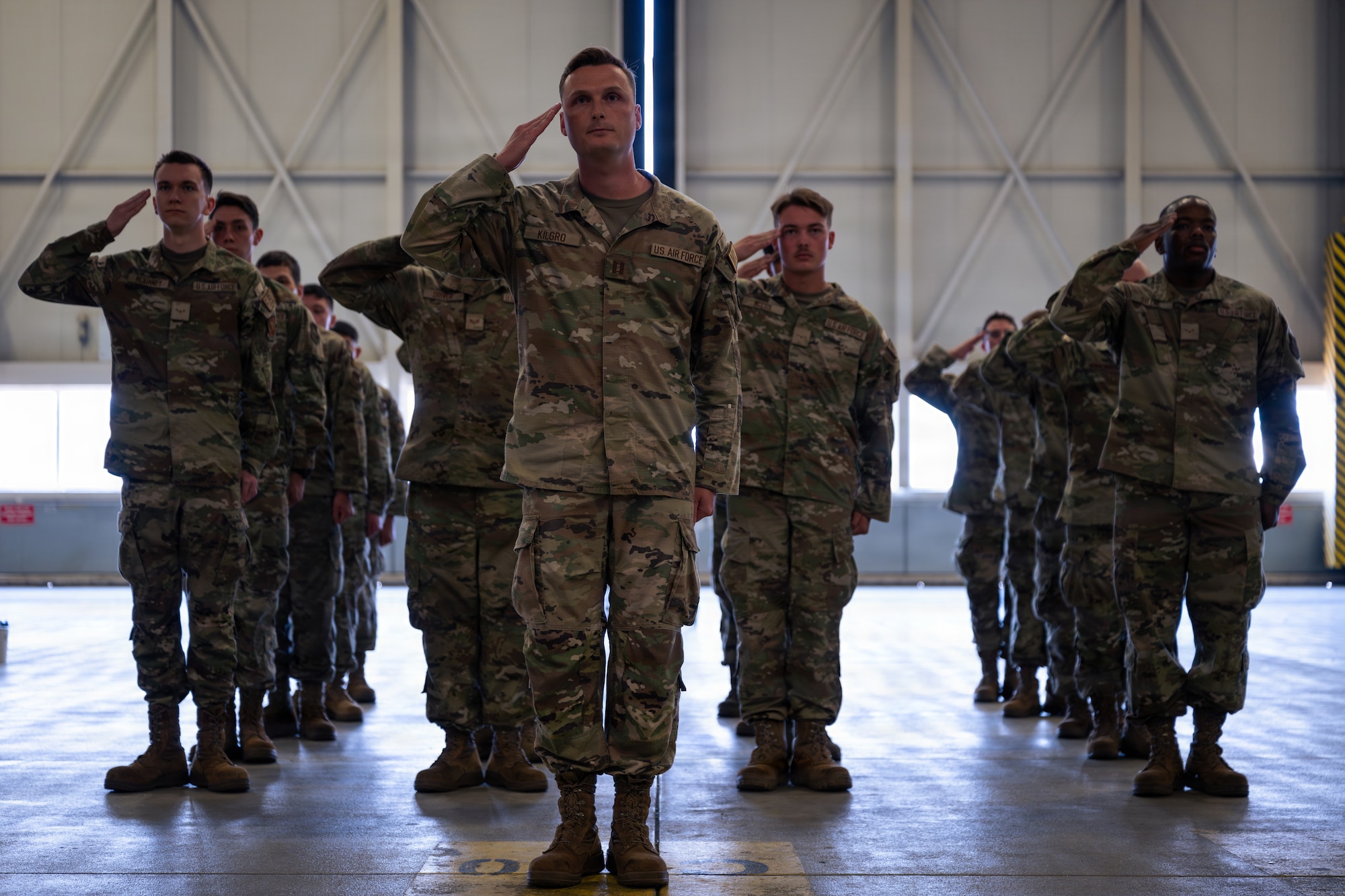 Airmen salute commander