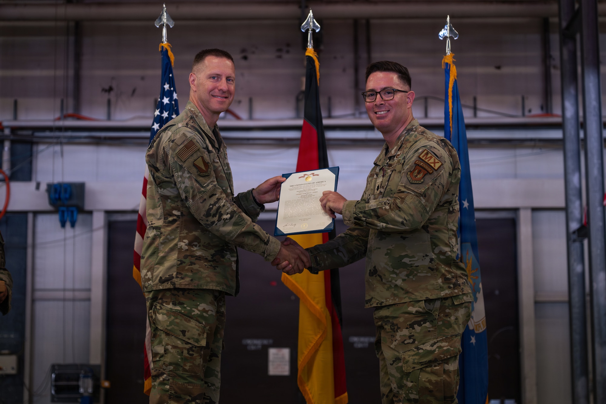 Airman presents Airman an medal