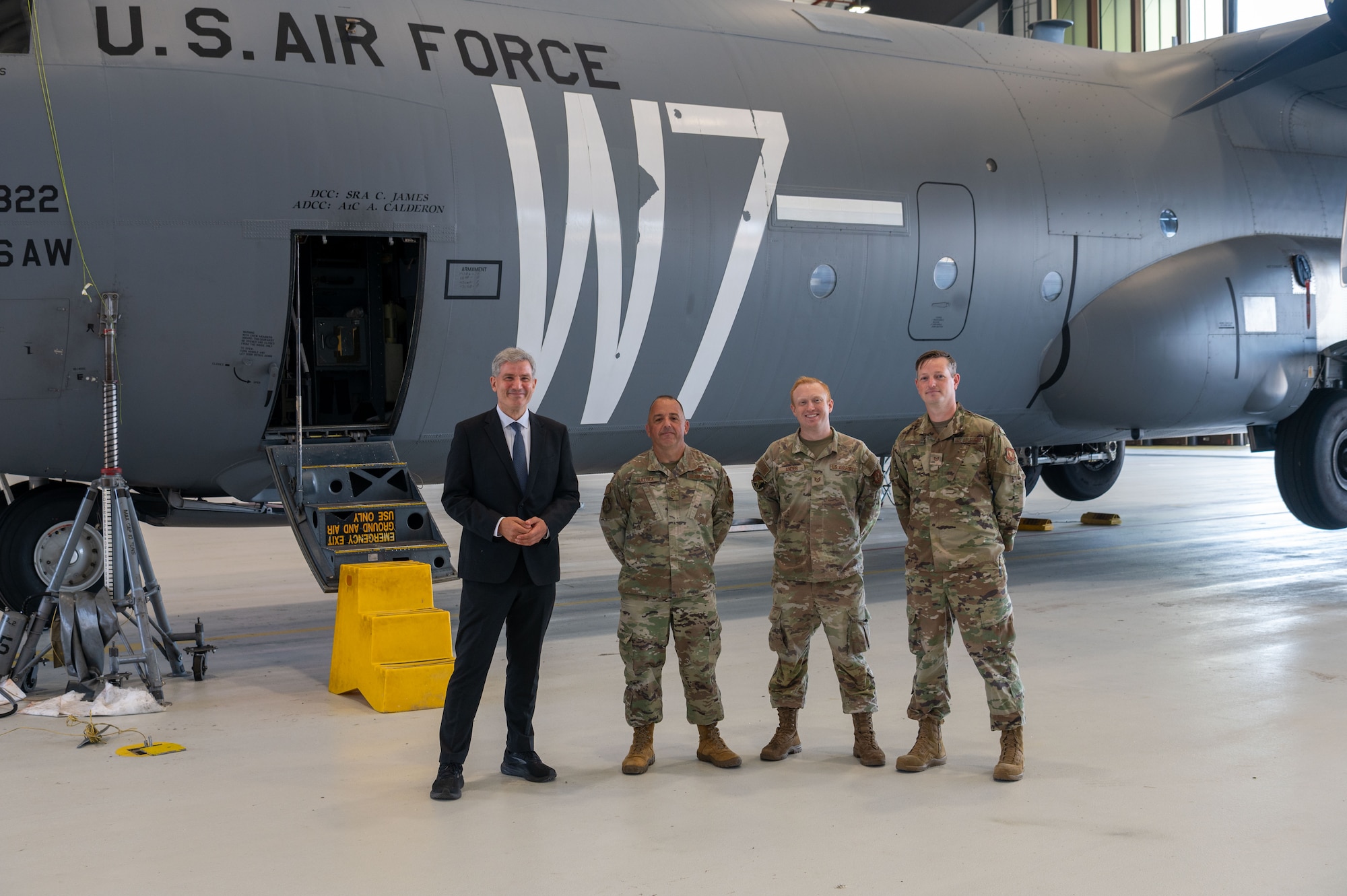 Metin Hakverdi, German Coordinator of Transatlantic Cooperation, left, receives a mission brief from U.S. Air Force Master Sgt. Devon Bullock, 37th Aircraft Maintenance flight chief.