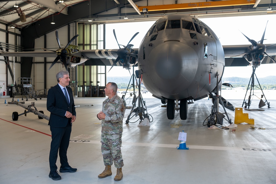 Metin Hakverdi, German Coordinator of Transatlantic Cooperation, left, receives a mission brief from U.S. Air Force Master Sgt. Devon Bullock, 37th Aircraft Maintenance flight chief, during his orientation visit