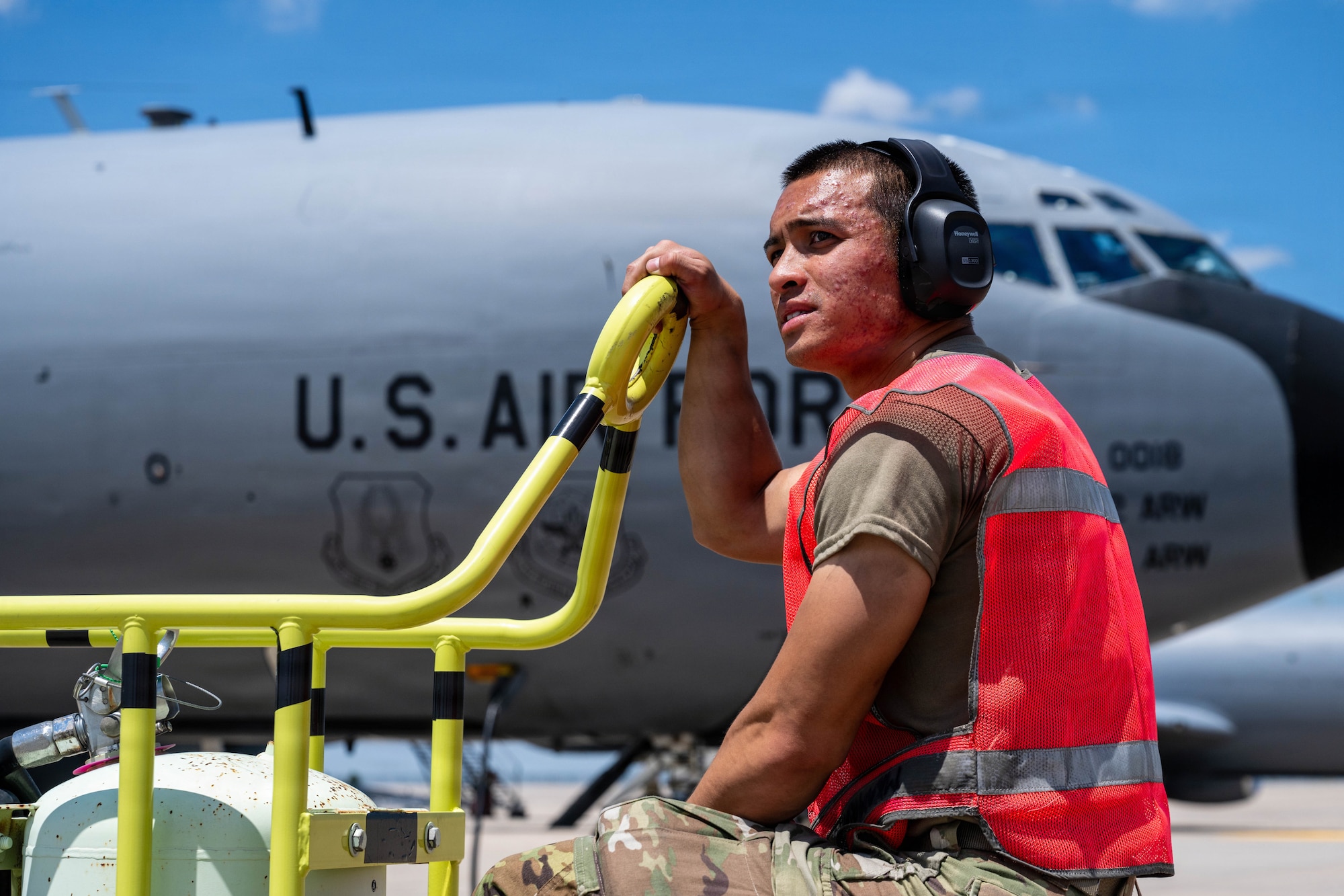 Airman 1st Class Bailey Vu, 722nd Aircraft Maintenance Squadron crew chief, stands by a fire bottle at McConnell Air Force Base, Kansas, July 14, 2026. Fire bottles are moved from engine-to-engine as they start-up for immediate fire response. (U.S. Air Force photo by Airman 1st Class Patrick O’Neill)