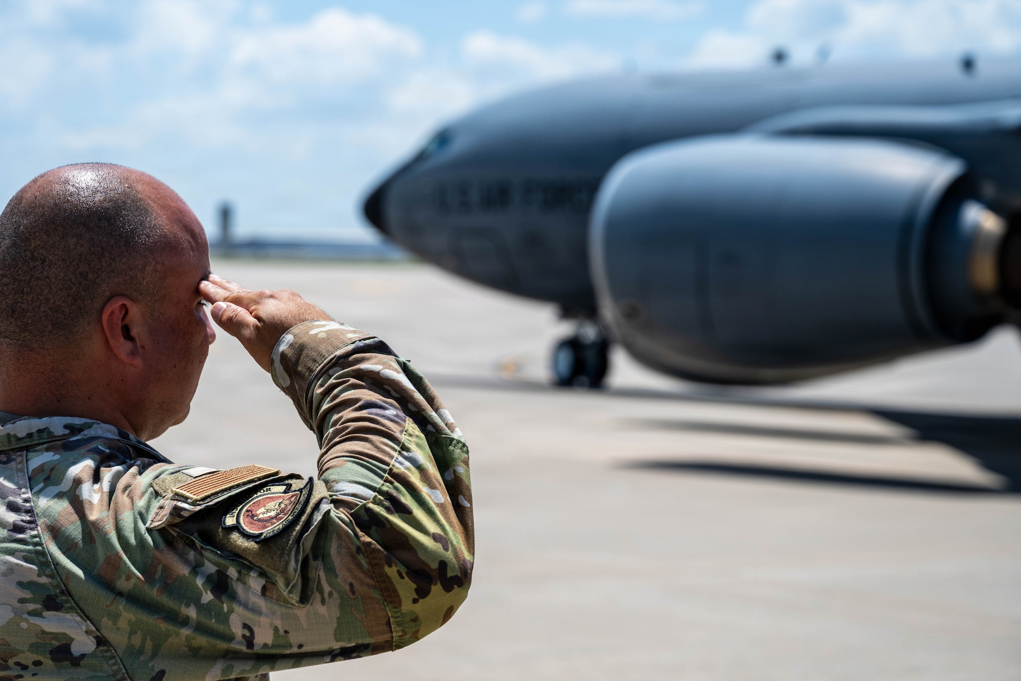 Master Sgt. Daniel Jordan, 350th Air Refueling Squadron future operations superintendent, salutes a KC-135 Stratotanker as it taxis away for its final departure from McConnell Air Force Base, Kansas, July 14, 2026. This event marks the first step toward a massive shift where Team McConnell will focus their efforts entirely on the KC-46A Pegasus. (U.S. Air Force photo by Airman 1st Class Patrick O’Neill)