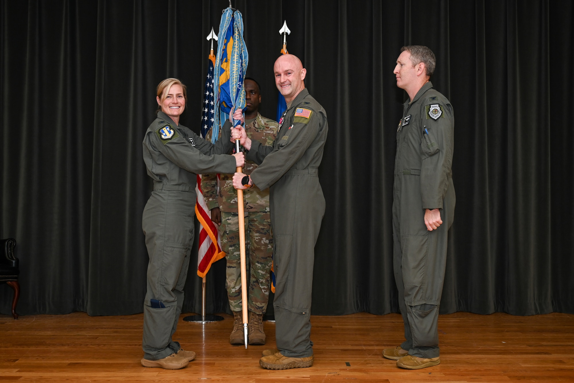A man holds a guidon.