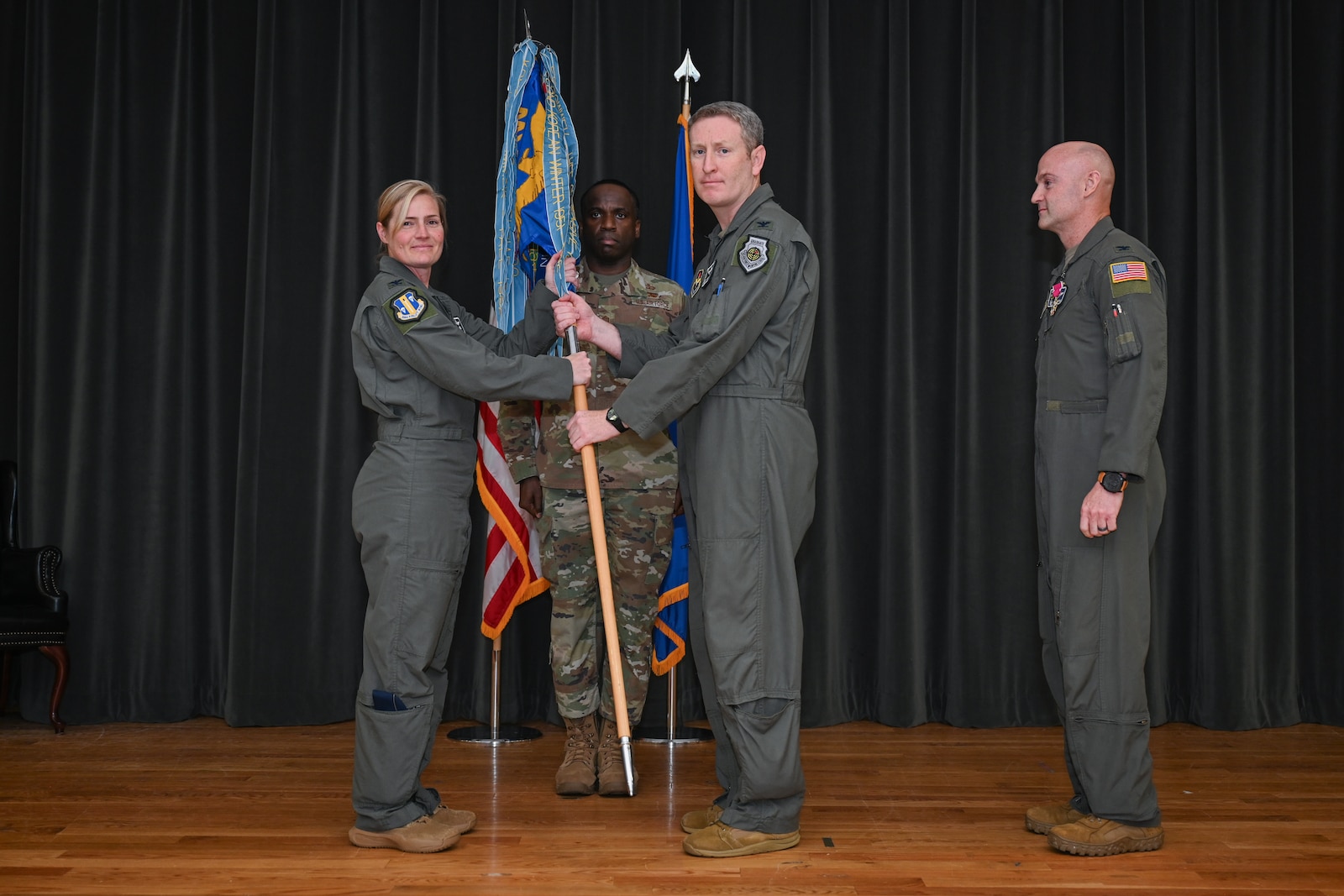 A man holds a guidon.