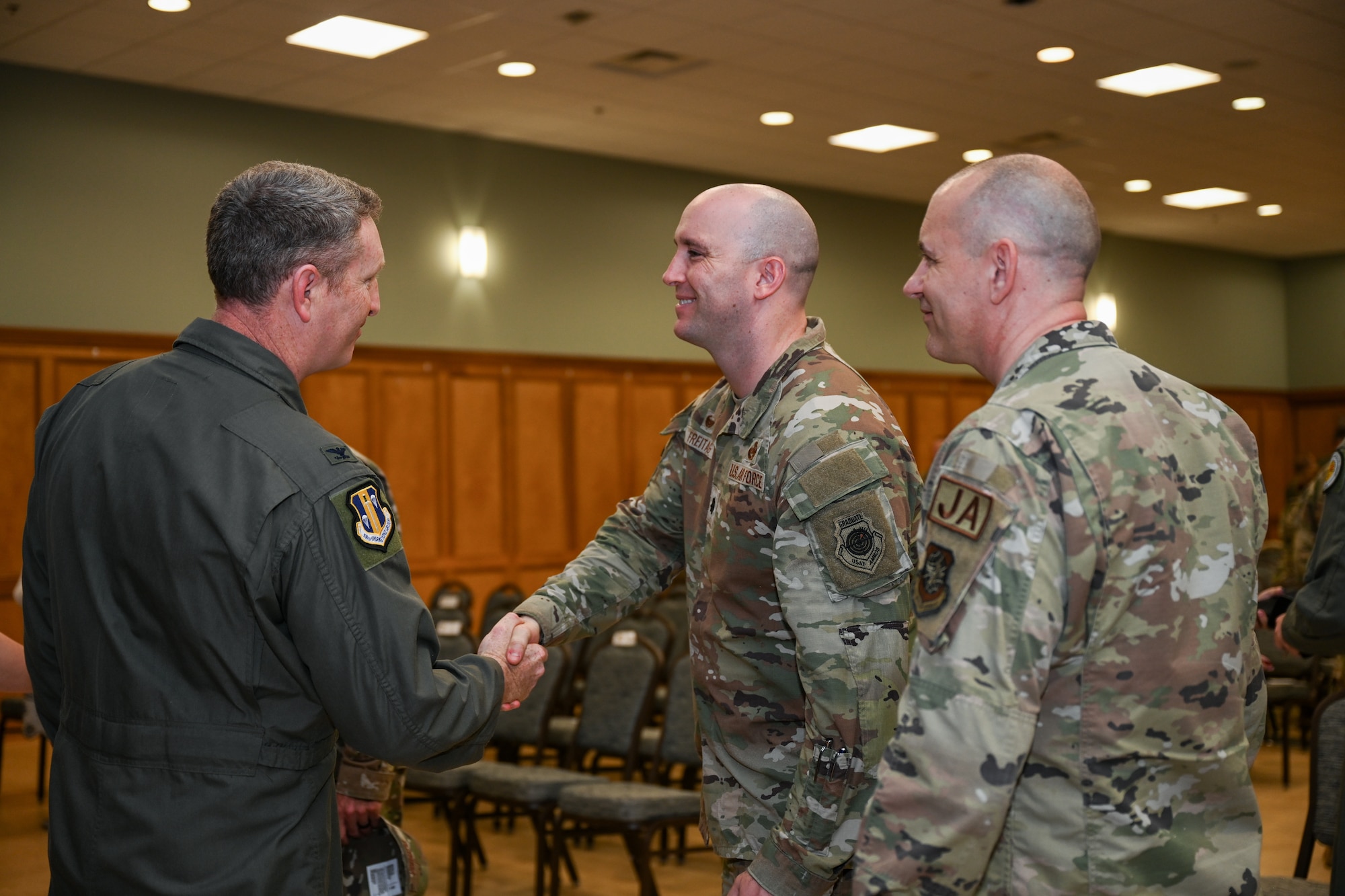 A man shakes someone's hand.
