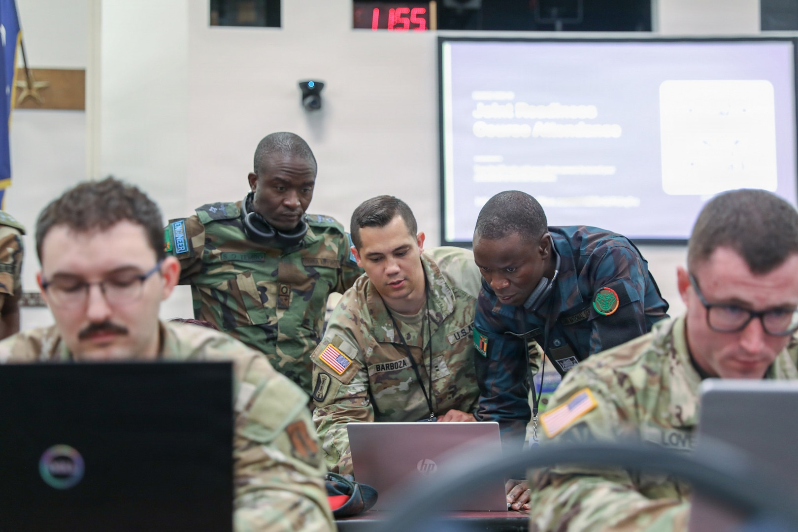 U.S. Army Chief Warrant Officer 2 Kyle Barboza, 176th Cyber Protection Team, assists international service members from Zambia, teaching cyber detection and incident response at the Professional Education Center in Little Rock, Arkansas, on July 15, 2026.
