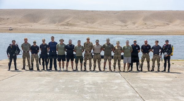 British Army, 22 Engineer Regiment dive team; British Royal Navy, 33 Explosive Ordnance Disposal and Search Regiment dive team; and members of the Ukrainian Navy Explosive Ordnance Disposal dive team; pose for a group photo after a diving training at Chisel Beach during exercise Sea Breeze 26-2 in Portland, United Kingdom, July 15, 2026.
