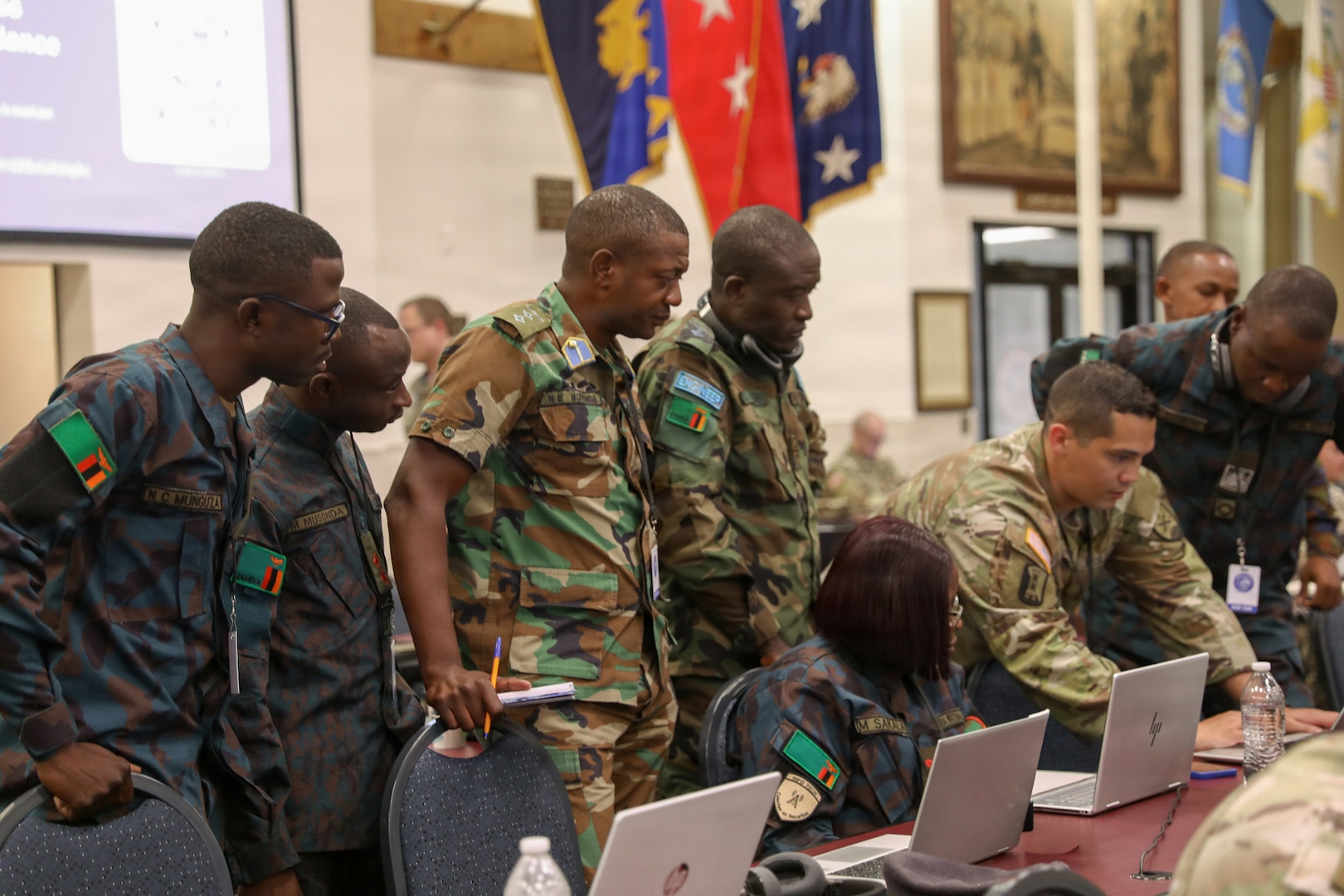U.S. Army Chief Warrant Officer 2, Kyle Barboza, 176th Cyber Protection Team, assists international service members from Zambia, teaching cyber detection and incident response at the Professional Education Center in Little Rock, Arkansas on July 15, 2026.