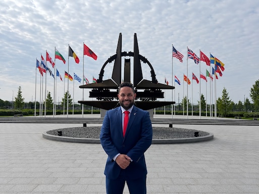 Giovanni Morales, business support branch chief for the Business Support Branch, Defense Logistics Agency Troop Support, and a Department of War Executive Leadership Development Program participant, stands outside the NATO Headquarters in Brussels, Belgium. Morales visited NATO as part of a rigorous 10-month ELDP travel schedule designed to prepare future defense executives for leadership roles. The global training allowed Morales to engage with international ambassadors and understand how logistics support agreements impact frontline military operations.