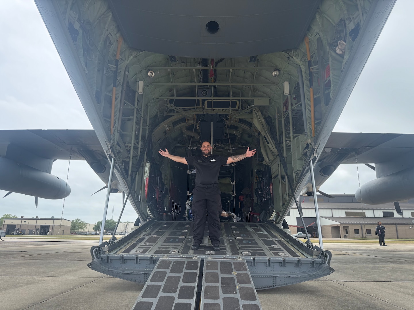 Giovanni Morales, business support branch chief for the Business Support Branch, Defense Logistics Agency Troop Support, and a Department of War Executive Leadership Development Program participant, stands in the cargo bay of a military transport aircraft during a training site visit. The cohort participated in hands-on training and site visits across multiple defense installations during the 10-month program. This training aimed to provide civilian leaders with firsthand experience in military logistics and operational readiness.