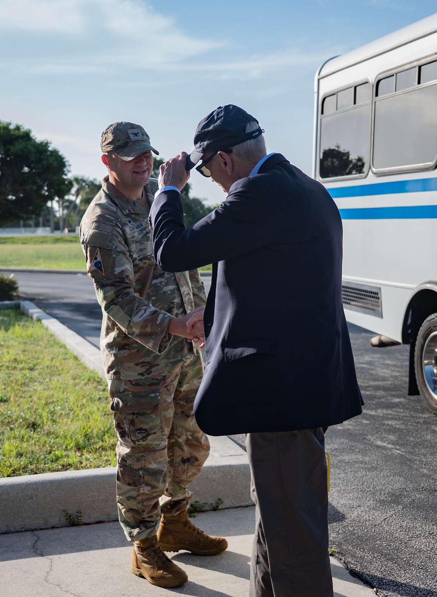 U.S. Space Force Col. Brian Chatman, Space Launch Delta 45 commander, greets Council on Foreign Relations (CFR) members as they deboard the bus before their meeting at Cape Canaveral Space Force Station, Florida, June 26, 2026. Members of the CFR met with Space Force Col. Brian Chatman, commander of Space Launch Delta 45, to discuss the scale of Space Coast operations, spaceport logistics and ways to ensure Canaveral Space Force Station remains the "Premier Gateway to Space." (U.S. Space Force photo by 2nd Lt. Christian Malaniak)