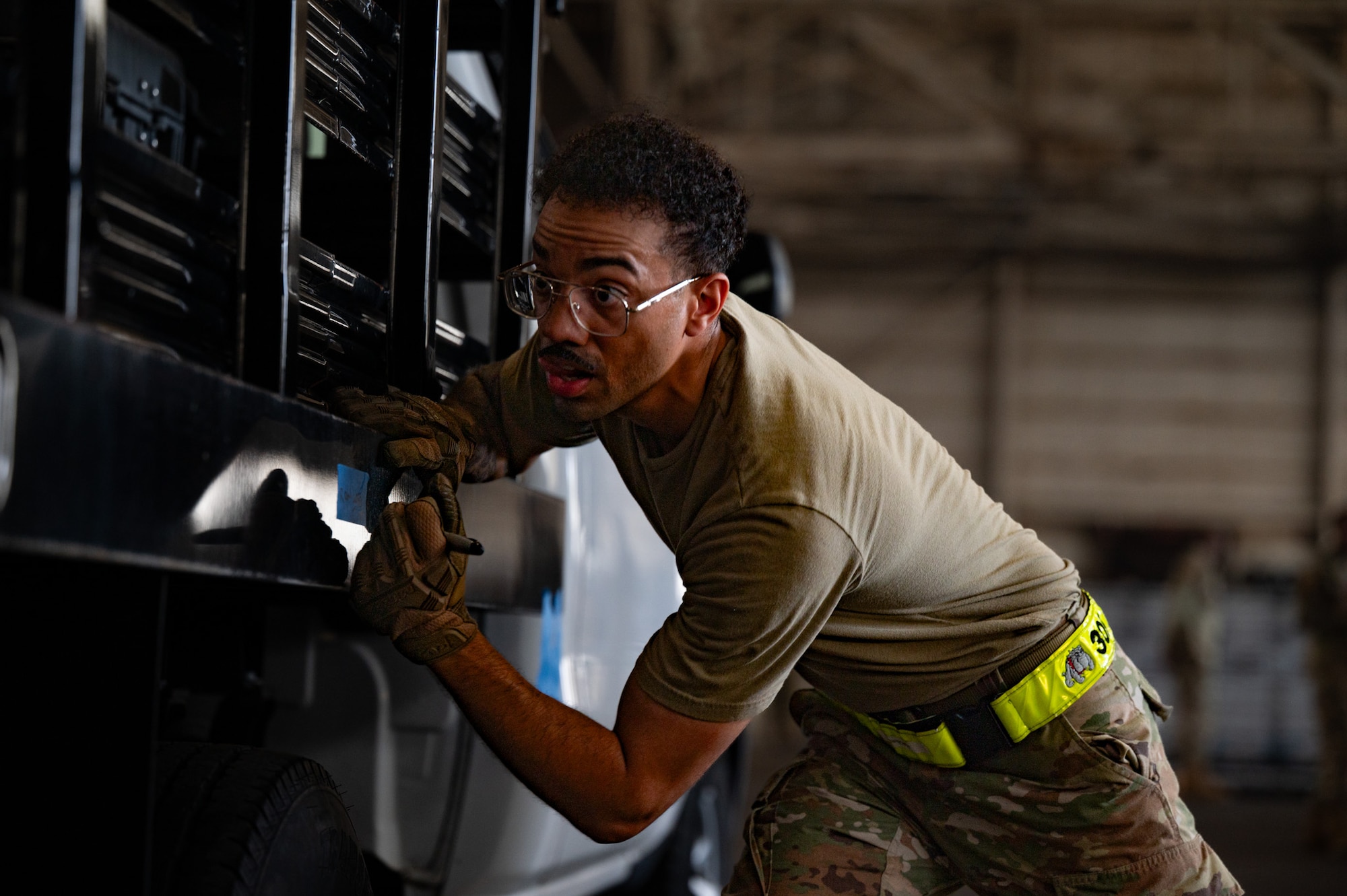 U.S. Air Force Staff Sgt. Rawn Prowell, 305th Aerial Port Squadron passenger services supervisor, performs center of balance tasks during a Port Dawg Rodeo at Joint Base McGuire-Dix-Lakehurst, N.J., July 10, 2026. The rodeo brought Airmen together to build teamwork skills and to strengthen unit cohesion through friendly competition. (U.S. Air Force photo by Airman 1st Class Haeleigh Bayle)