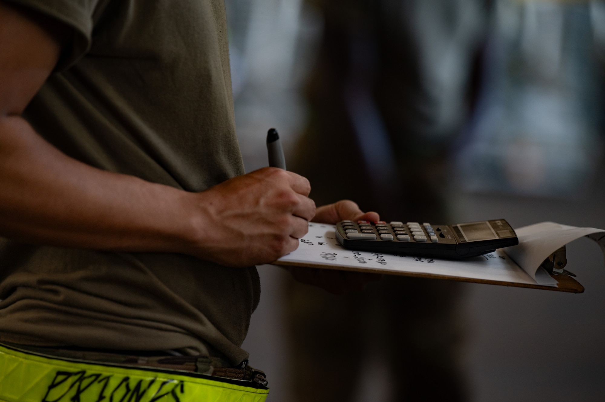 A U.S. Air Force Airman assigned to the 305th Aerial Port Squadron, completes center of balance compute tasks during a Port Dawg Rodeo at Joint Base McGuire-Dix-Lakehurst, N.J., July 10, 2026. The rodeo challenged Airmen to complete their everyday tasks under time restraints and tested their abilities to work together under time constraints. (U.S. Air Force photo by Airman 1st Class Haeleigh Bayle)