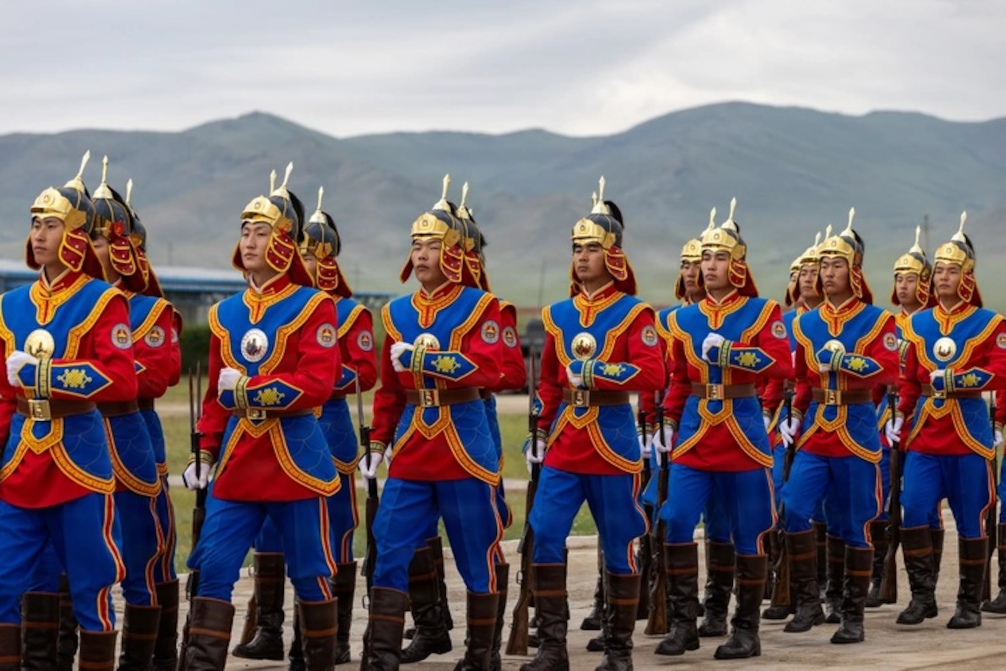 Mongolian soldiers march during the closing ceremony of Khaan Quest 2026 at the Five Hills Training Facility near Ulaanbaatar, Mongolia, July 3, 2026. Since 2003, Khaan Quest, the Indo-Pacific's largest Peacekeeping Operations exercise, has promoted regional peace and security through multinational and multicomponent training. (U.S. Army photo by Sgt. Joseph Liggio)