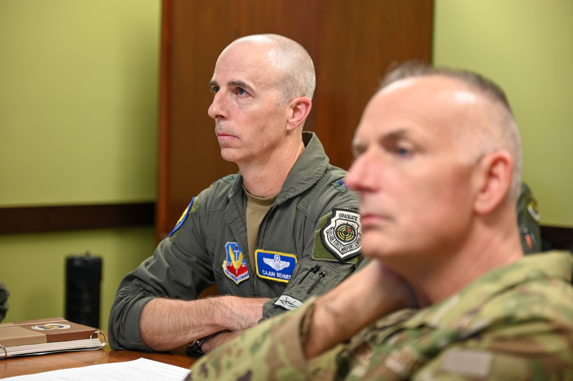 U.S. Air Force Maj. Gen. Steven Behmer, 15th Air Force commander, left, and Chief Master Sgt. Nikki Drago, 15th AF command chief, are briefed by the 56th Range Management Office during a base tour at Luke Air Force Base, Arizona, July 20, 2026.
