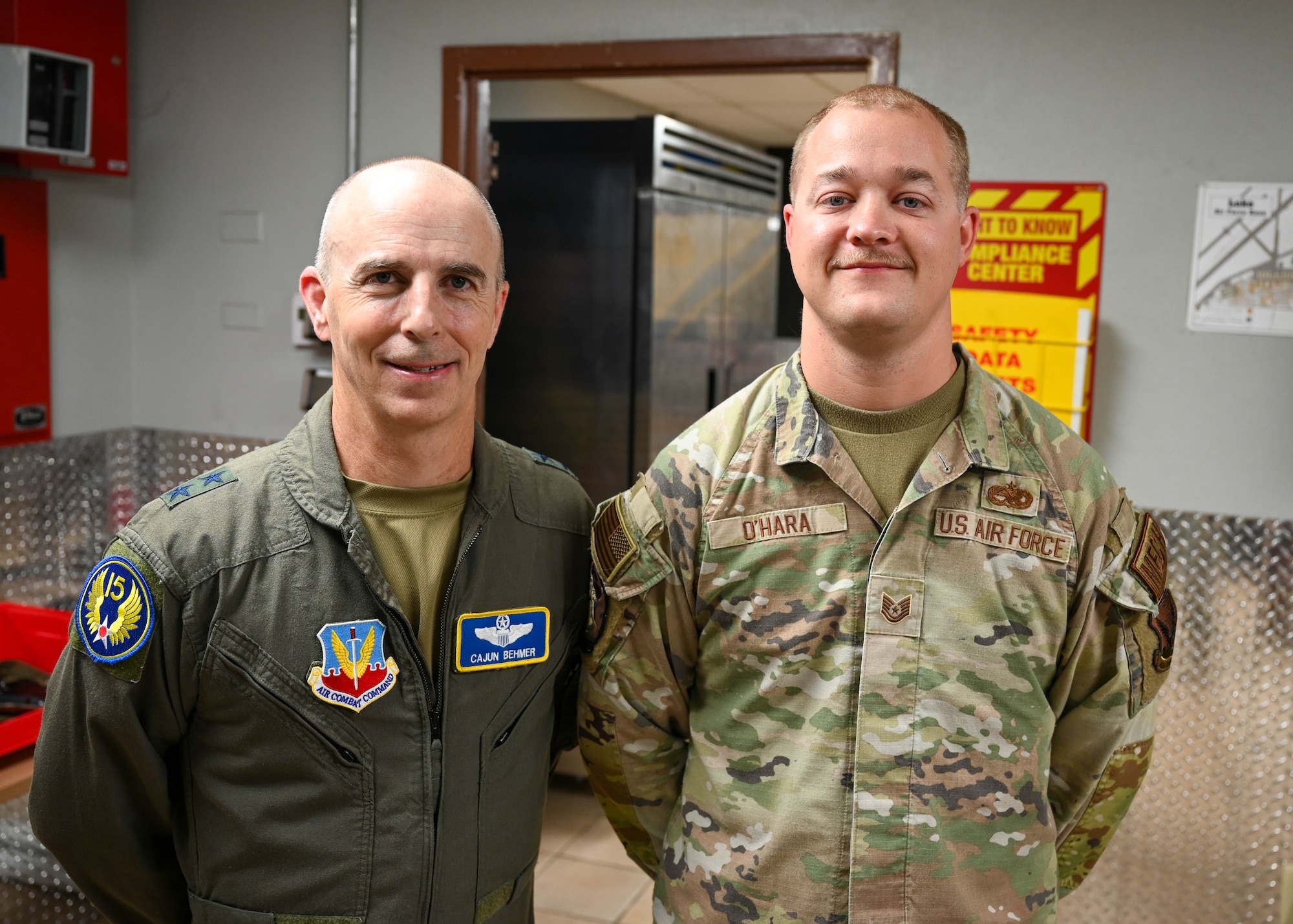 U.S. Air Force Maj. Gen. Steven Behmer, 15th Air Force commander, poses for a photo with Tech. Sgt. Jacob Ohara, 61st Aircraft Maintenance Unit flightline expeditor, during a base tour at Luke Air Force Base, Arizona, July 20, 2026.