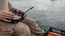 U.S. Marine Corps Sgt. Evan Conlon, an explosive ordnance technician with Charlie Section, littoral explosive ordnance neutralization, 3rd EOD Company, 9th Engineer Support Battalion, 3rd Marine Logistics Group, calibrates a GPS on a remotely operated vehicle during Combined Joint Logistics Over-the-Shore 26 at Pohang Port, South Korea, June 24, 2026. CJLOTS 26 is a combined exercise designed to integrate U.S. and Republic of Korea lighterage and ship-to-shore connector capabilities, improve combined readiness, strengthen the Republic of Korea–U.S. alliance, and expand combined maritime sustainment capacity during logistics operations. (U.S. Marine Corps photo by Cpl. Pedro Rojas)