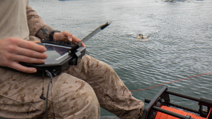 U.S. Marine Corps Sgt. Evan Conlon, an explosive ordnance technician with Charlie Section, littoral explosive ordnance neutralization, 3rd EOD Company, 9th Engineer Support Battalion, 3rd Marine Logistics Group, calibrates a GPS on a remotely operated vehicle during Combined Joint Logistics Over-the-Shore 26 at Pohang Port, South Korea, June 24, 2026. CJLOTS 26 is a combined exercise designed to integrate U.S. and Republic of Korea lighterage and ship-to-shore connector capabilities, improve combined readiness, strengthen the Republic of Korea–U.S. alliance, and expand combined maritime sustainment capacity during logistics operations. (U.S. Marine Corps photo by Cpl. Pedro Rojas)