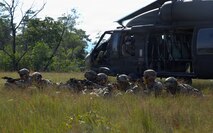 U.S. Army infantrymen assigned to Company C, “Kulepbla,” and Company D, “Dulaslas,” 1st Battalion, 294th Infantry Regiment, Guam Army National Guard, pull security around the landing zone of a UH-60 Black Hawk helicopter after inserting into their area of operations during air assault training as part of Exercise Keris Strike 26 conducted near Kota Belud inSabah, Malaysia, July 17, 2026.