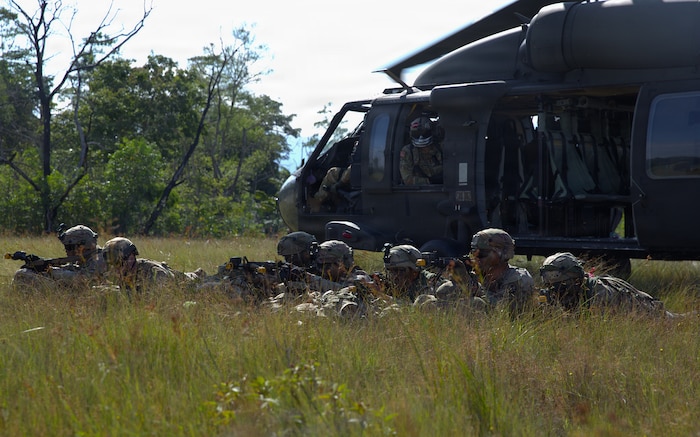 U.S. Army infantrymen assigned to Company C, “Kulepbla,” and Company D, “Dulaslas,” 1st Battalion, 294th Infantry Regiment, Guam Army National Guard, pull security around the landing zone of a UH-60 Black Hawk helicopter after inserting into their area of operations during air assault training as part of Exercise Keris Strike 26 conducted near Kota Belud inSabah, Malaysia, July 17, 2026.