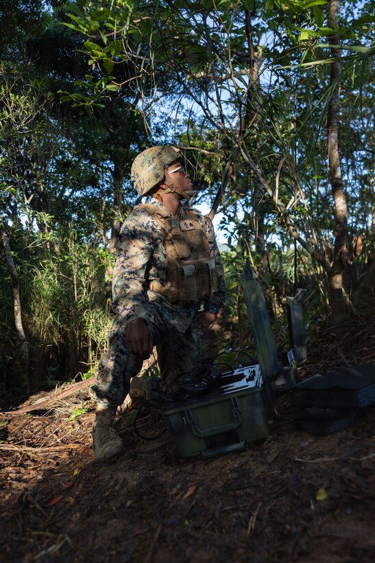 U.S. Marine Corps Sgt. Johnny Howard, a small unmanned aircraft system operator with 12th Littoral Combat Team, 12th Marine Littoral Regiment, 3rd Marine Division, sets up the Neros Archer Strike Variant drone system at Camp Schwab, Okinawa, Japan, May 7, 2026. Neros Archer Attack Drone Team Concept is a training event designed to demonstrate battery charging fundamentals, navigation, obstacle maneuvering, and foundational flight operations using the Neros Archer Strike Variant Drone. Howard is a native of Texas. (U.S. Marine Corps photo by Lance Cpl. Camila Garibay)