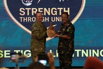 Australian Army Maj. Gen. Giles J.S. Cornelia, Deputy Commanding General - Strategy and Plans for U.S. Army Pacific (USARPAC) receives a gift from Bangladesh Army Lt. Gen. Md Mainur Rahman, OSP, SUP, awc, psc, Chief of General Staff, during the opening ceremony of Tiger Lightning 2026 in Bangladesh, July 19, 2026.