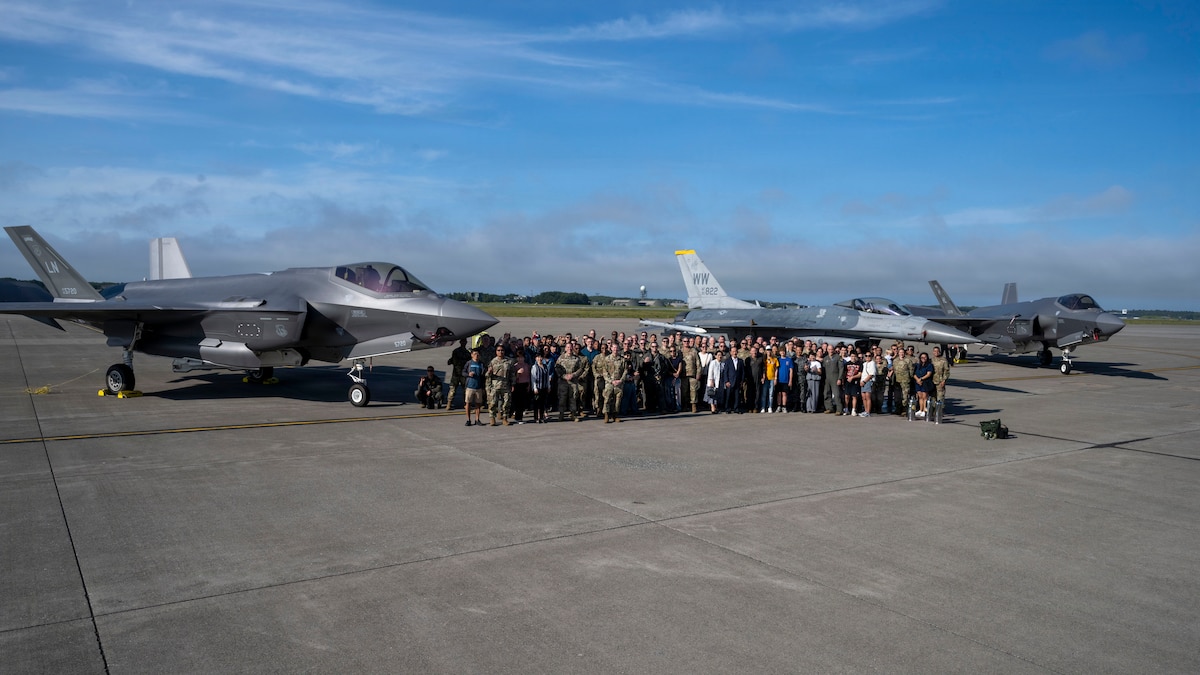Members of the 35th Fighter Wing (FW), Naval Air Facility Misawa, Japan Air Self-Defense Force and families pose for a group photo after U.S. Air Force Col. Davidson’s, 35th FW commander, final flight at Misawa Air Base, Japan, June 7, 2026. The event honored Col. Davidson’s final opportunity to fly as commander of the 35th FW, recognizing both the aviation tradition of a final flight before changing assignments and his leadership throughout the assignment. (U.S. Air Force photo by Senior Airman Patrick Boyle)