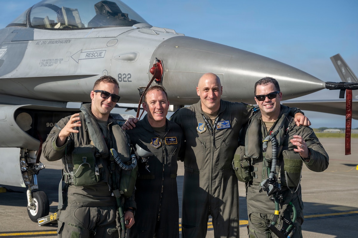U.S. Air Force Col. Paul Davidson, 35th Fighter Wing commander, poses for a group photo after his final flight at Misawa Air Base, Japan, June 7, 2026. The ceremony reflected the tradition of recognizing an aviator's final flight before departing changing assignments, commemorating Col. Davidson's service as both a pilot and wing commander. (U.S. Air Force photo by Senior Airman Patrick Boyle)