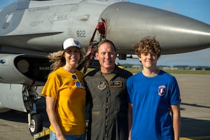 U.S. Air Force Col. Paul Davidson, 35th Fighter Wing commander, poses for a photo with his family after his final flight at Misawa Air Base, Japan, June 7, 2026. The tradition commemorates an aviator's final flight before changing assignments, commemorating Col. Davidson's service as both a pilot and wing commander. (U.S. Air Force photo by Senior Airman Patrick Boyle)