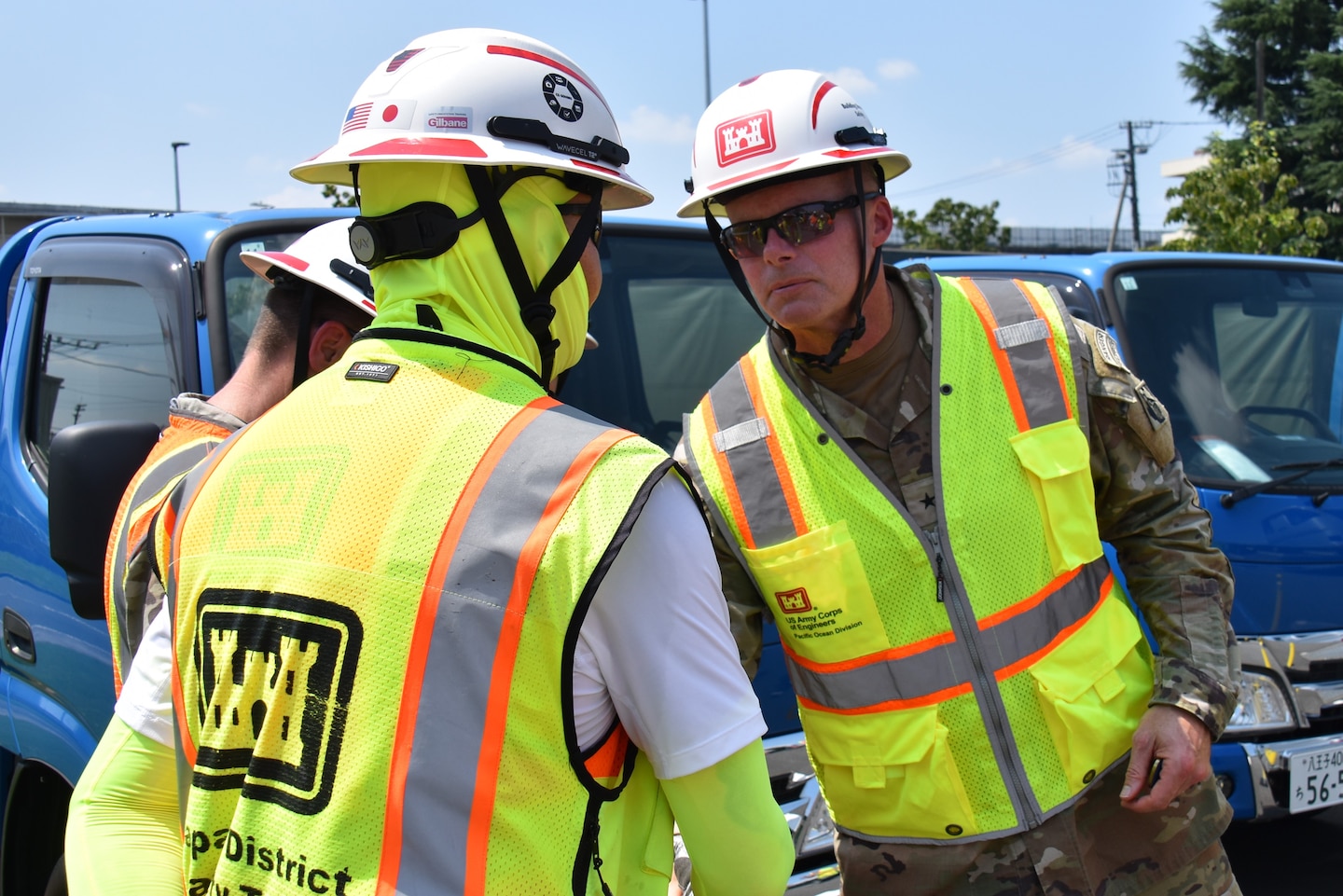 John Fromuth, Construction Control Representative, U.S. Army Corps of Engineers – Japan District, earns a coin from Brig. Gen. Joseph C. “Clete” Goetz II, commander, U.S. Army Corps of Engineers – Pacific Ocean Division, following a construction site visit on Yokota Air Base, Japan, July 21, 2026.