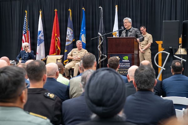 Jensen Huang, founder and CEO of NVIDIA, delivers remarks during the NVIDIA DGX GB300 AI supercomputer commissioning ceremony at the Naval Postgraduate School (NPS) in Monterey, California, July 22, 2026. The ceremony highlighted collaboration between NPS, military leaders and industry in support of defense-focused research and education. (U.S. Navy photo by Mass Communication Specialist 2nd Class Abreen Padeken)