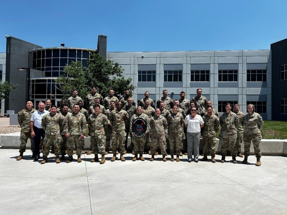 Members of 10th Force Development Squadron, Space Delta 10, pose for a group photo July 2, 2026, at The Aerospace Corporation in Colorado Springs, Colorado.