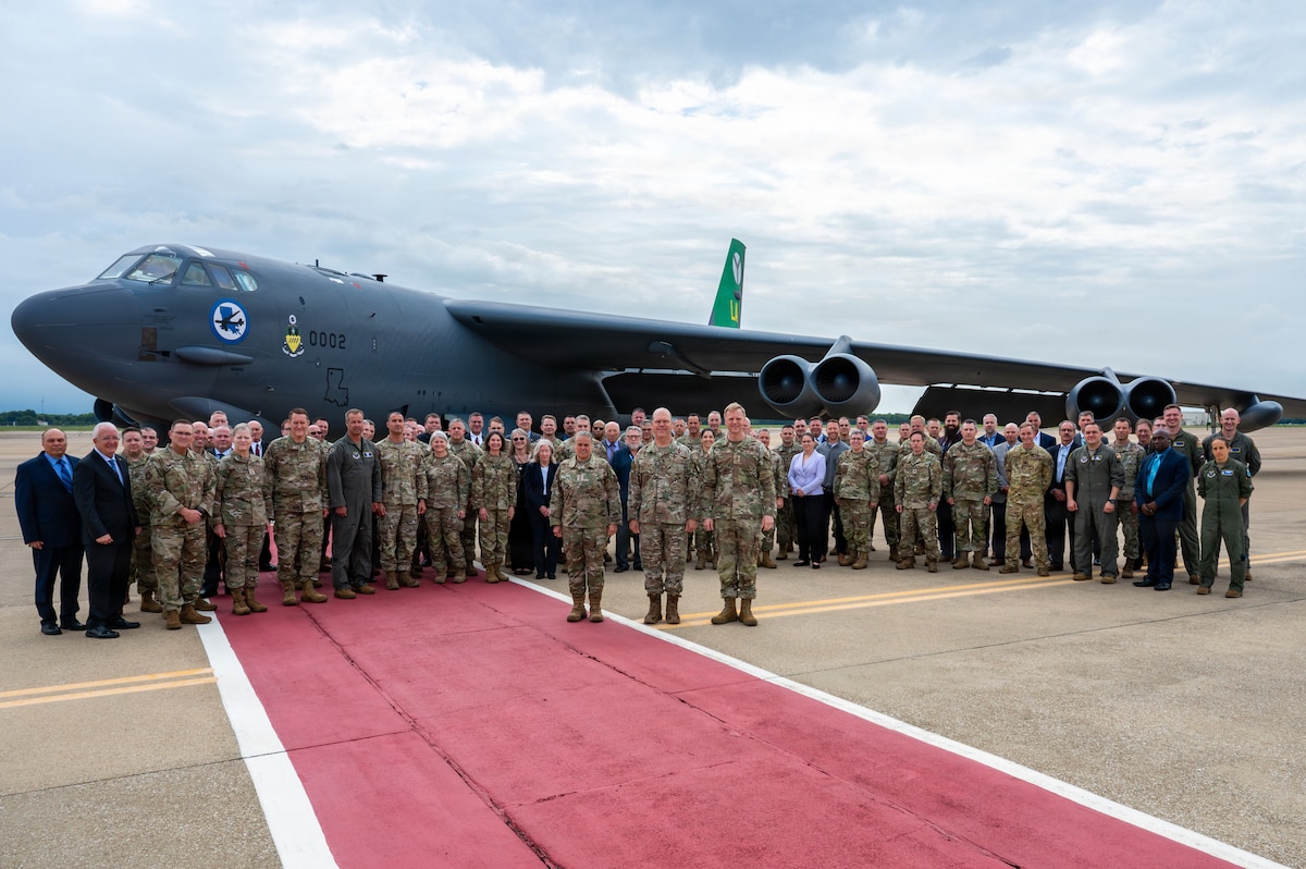 U.S. Air Force Gen. S.L. Davis, front center, commander of Air Force Global Strike Command, Lt. Gen. Linda Hurry, front left, commander of Air Force Materiel Command, and Lt. Gen. Luke Cropsey, military deputy for the Office of the Assistant Secretary of the Air Force for Acquisition, Technology and Logistics, take a group photo with 2026 Technology, Acquisition and Sustainment Review attendees in front of a B-52H Stratofortress aircraft at Barksdale Air Force Base, Louisiana, June 24, 2026. AFGSC hosted the TASR to create an opportunity for high-level officials to go over acquisition programs and cost capabilities to better equip and support our Airmen who execute the global strike mission. (U.S. Air Force photo by Airman 1st Class Preston Crawford)
