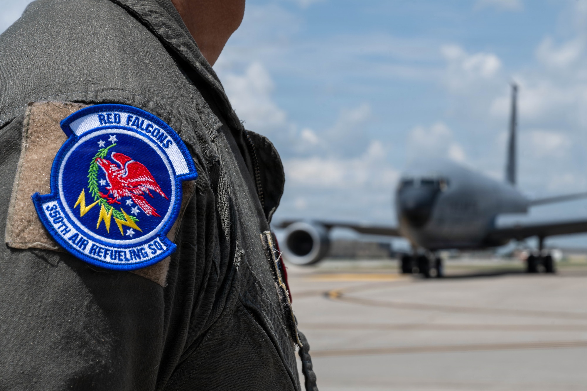 Master Sgt. Antoine Nguyen, 350th Air Refueling Squadron senior enlisted leader, honors a KC-135 Stratotanker as it taxis away for its final departure from McConnell Air Force Base, Kansas, July 15, 2026. This event marked a massive shift where Team McConnell will focus their efforts entirely on the KC-46A Pegasus. (U.S. Air Force photo by Airman 1st Class Patrick O’Neill)