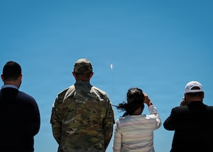Sylvie Bédard, center right, consul general of Canada in Los Angeles, stands beside U.S. Space Force 1st Lt. Matthew Wood, center left, 2nd Range Operations Squadron mission integrator, and members of the Canadian Consulate General delegation to observe the launch of a SpaceX Falcon 9 rocket carrying the Space Development Agency’s Tranche 1 Transport Layer-E mission from Vandenberg Space Force Base, California, July 16, 2026. The launch viewing was part of Bédard’s two-day visit to gain greater familiarity with Vandenberg’s launch mission and the installation’s role in supporting military, civil and commercial space operations. (U.S. Space Force photo by Senior Airman Olya Houtsma)