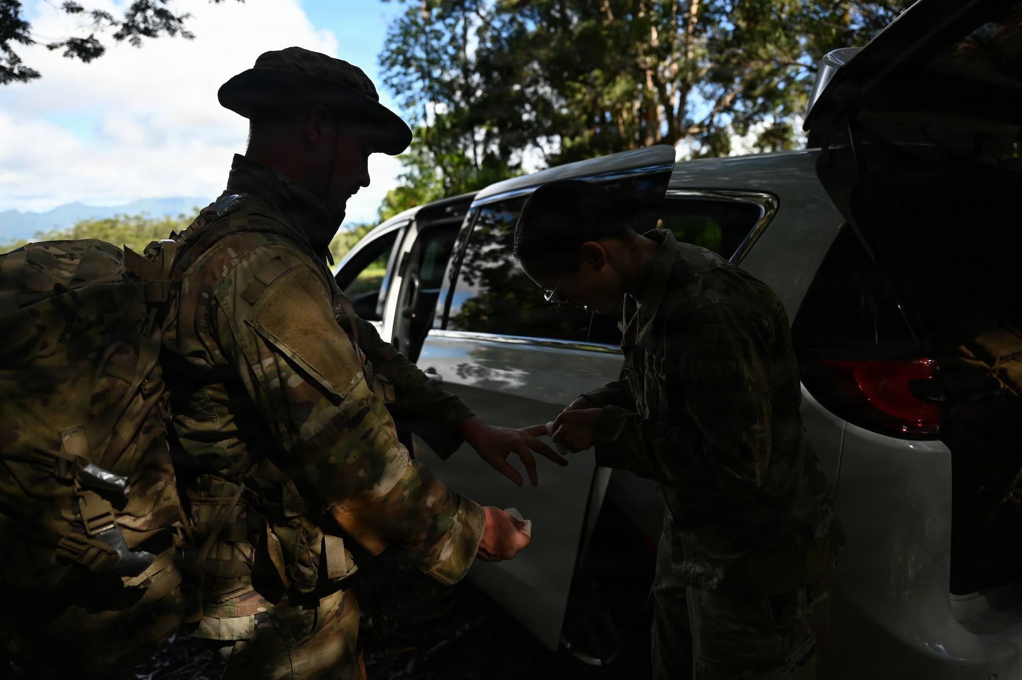 An Airman assigned to the 178th Medical Group assists an injured Airman during annual training at Schofield Barracks, Hawaii, July 13, 2026. The training challenges Airmen to strengthen tactical proficiency, teamwork and expeditionary readiness while operating in unfamiliar terrain and austere conditions. (U.S. Air National Guard photo by Tech. Sgt. Tiffany Scofield)