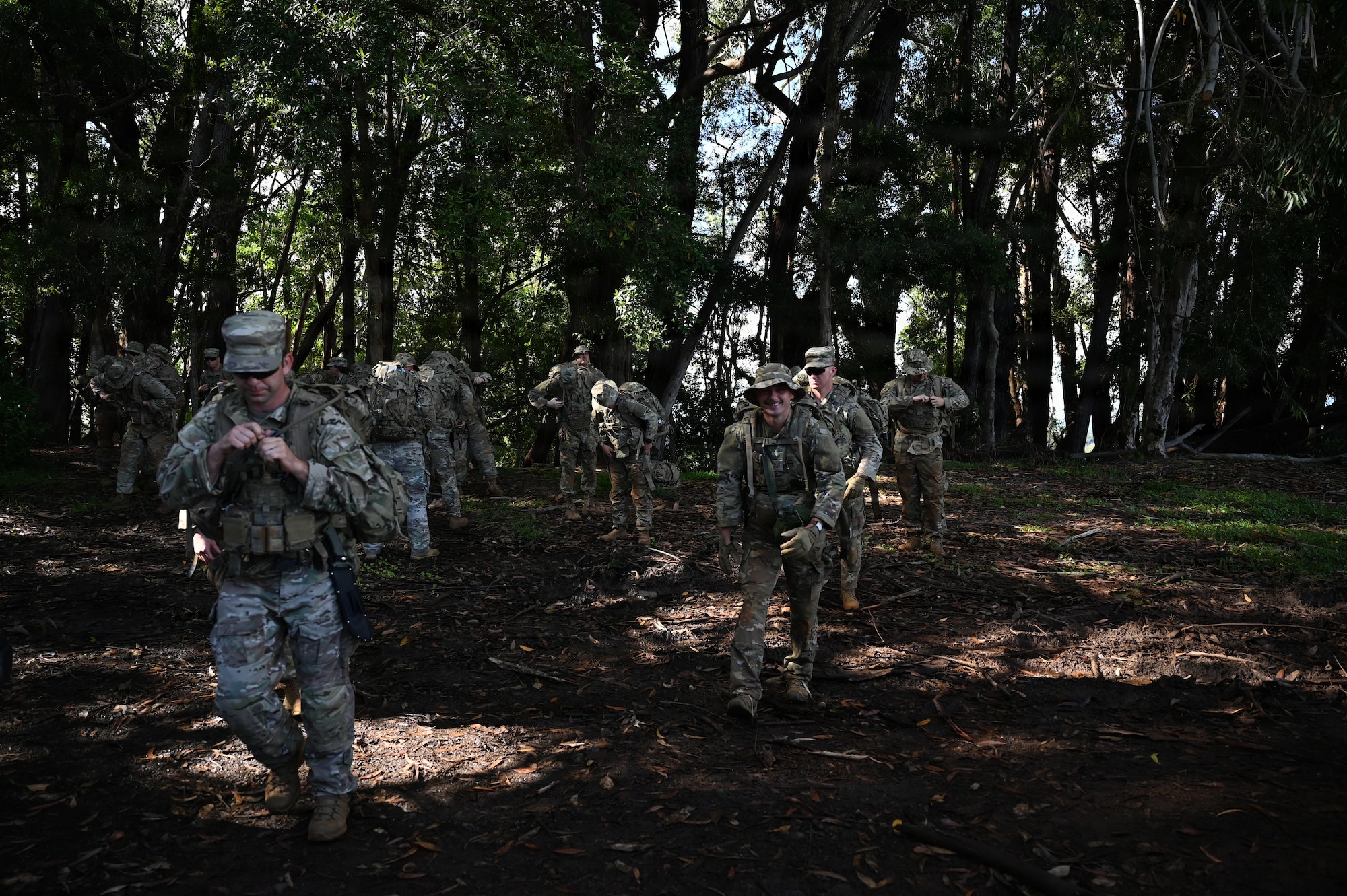 Security Forces Airmen begin their first ruck march during annual training at Schofield Barracks, Hawaii, July 13, 2026. The training challenges Airmen to strengthen tactical proficiency, teamwork and expeditionary readiness while operating in unfamiliar terrain and austere conditions. (U.S. Air National Guard photo by Tech. Sgt. Tiffany Scofield)