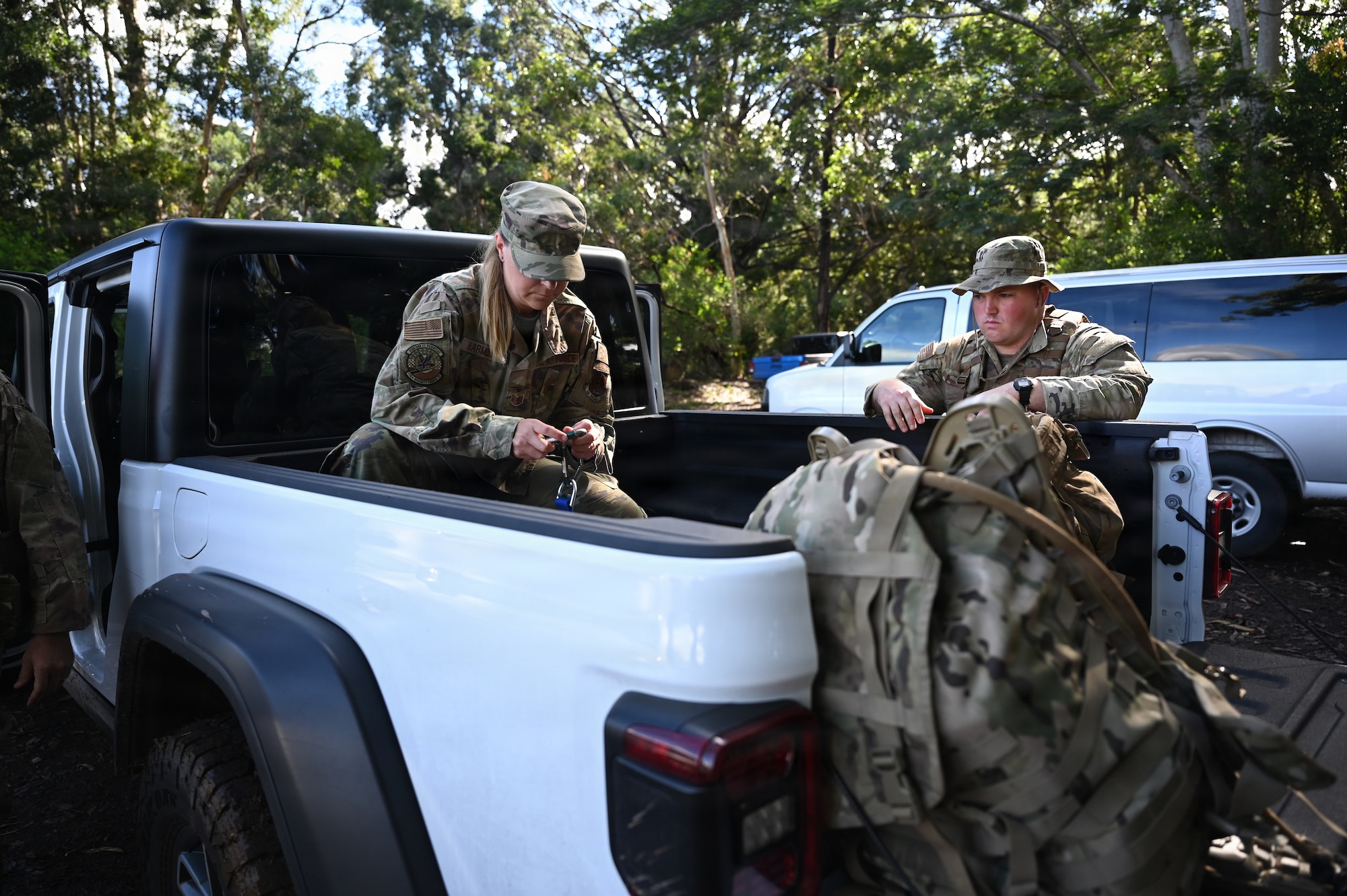 Tech. Sgt. Harmon prepares carabiners and other equipment before the first iteration of training at Schofield Barracks, Hawaii, July 13, 2026. Airmen assigned to the Ohio Air National Guard's 178th Security Forces Squadron participate in annual training at Schofield Barracks, Hawaii, July 13-27, 2026, to strengthen tactical proficiency, teamwork and expeditionary readiness. (U.S. Air National Guard photo by Tech. Sgt. Tiffany Scofield)