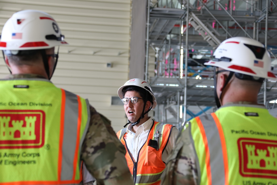 A project engineer from U.S. Army Corps of Engineers – Japan District briefs various projects under construction to representatives from across USACE Pacific Ocean Division.