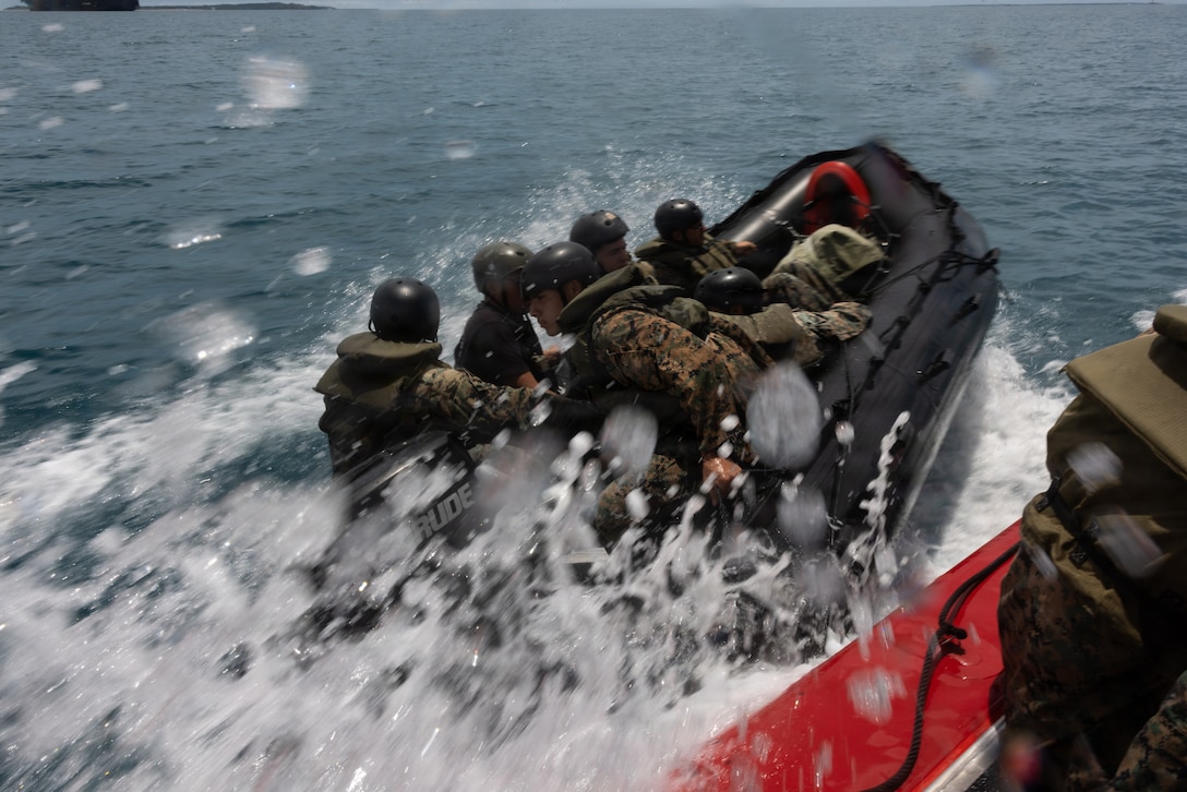 U.S. Marines with III MEF, operate a combat rubber raiding craft during coxswain training at White Beach, Okinawa, Japan, May 14, 2026. 12th Littoral Logistics Battalion hosted a weeklong coxswain training event to expand the combat and logistical effectiveness in maritime environments. (U.S. Marine Corps photo by Lance Cpl. Robert Blanks)