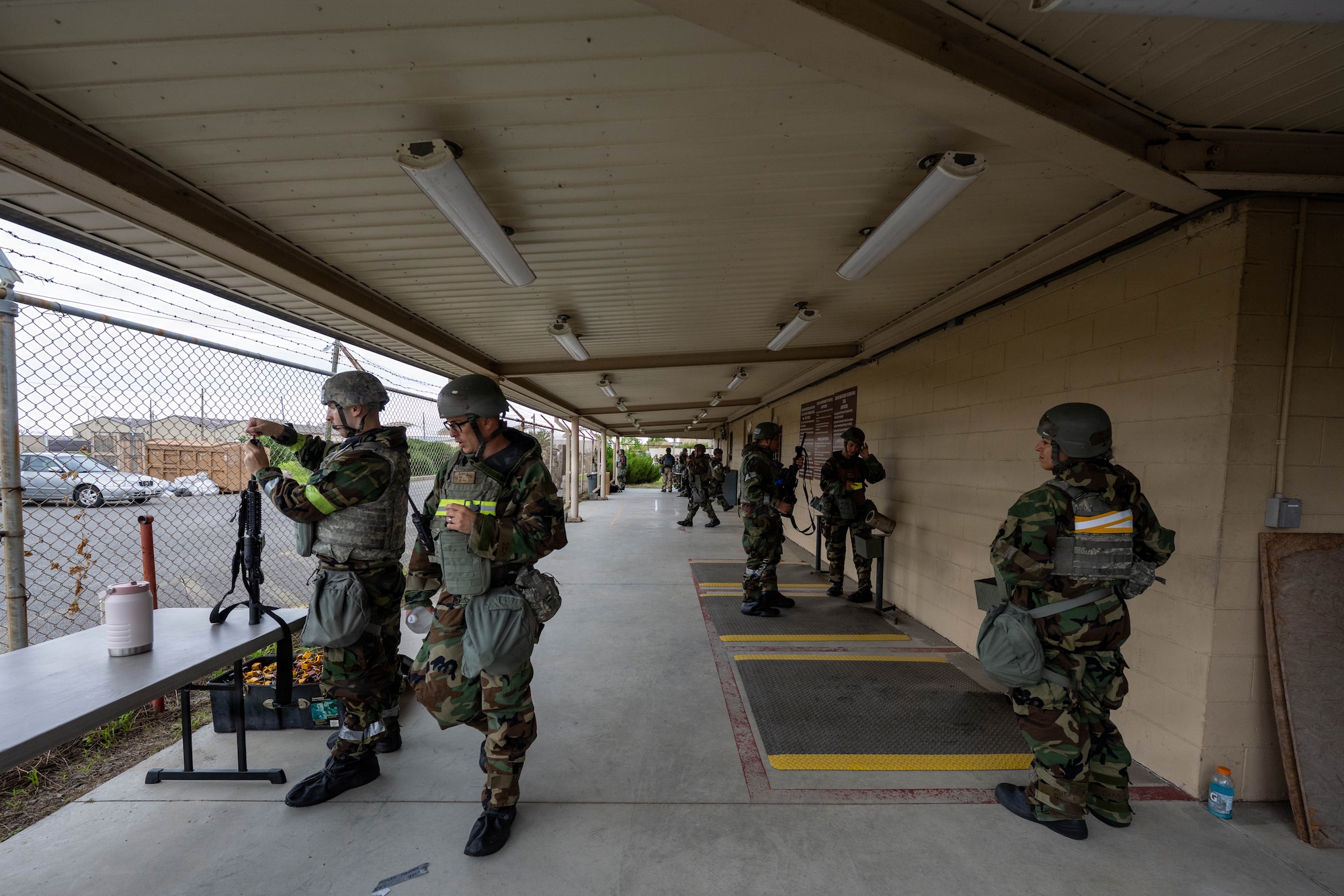 U.S. Air Force Airmen assigned to the 8th Fighter Wing go through a general arming process during exercise Beverly Sentinel 26-4 at Kunsan Air Base, Republic of Korea, July 21, 2026. During Bev. Sent. 26-4, 8th FW Airmen were issued M4 carbines and M18 pistols under general arming procedures, preparing them for exercise base defense operations. Every Airman utilizes exercises such as Bev. Sent. 26-4 to hone technical skills and build the combat-credible mindset required for the modern battlefield. (U.S. Air Force photo by Senior Airman Tabatha Chapman)