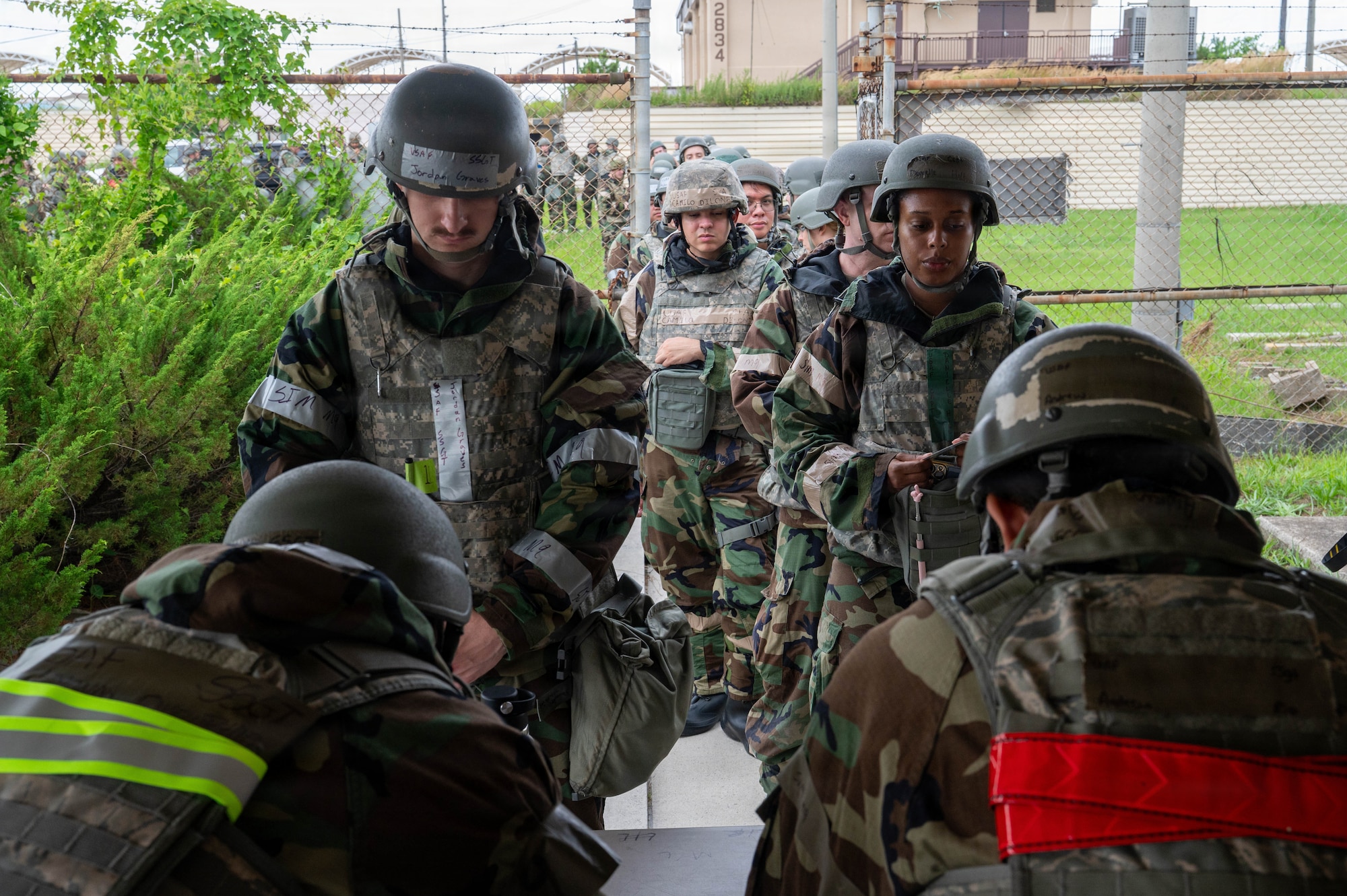 U.S. Air Force Airmen assigned to the 8th Fighter Wing check-in at the 8th Logistics Readiness Squadron armory during exercise Beverly Sentinel 26-4 at Kunsan Air Base, Republic of Korea, July 21, 2026. During Bev. Sent. 26-4, 8th FW Airmen were issued M4 carbines and M18 pistols under general arming procedures, preparing them for exercise base defense operations. Training scenarios focused on defensive maneuvers and infrastructure protection, reinforcing 8th FW’s capacity to safeguard personnel and assets against potential threats. (U.S. Air Force photo by Staff Sgt. Cedrique Oldaker)