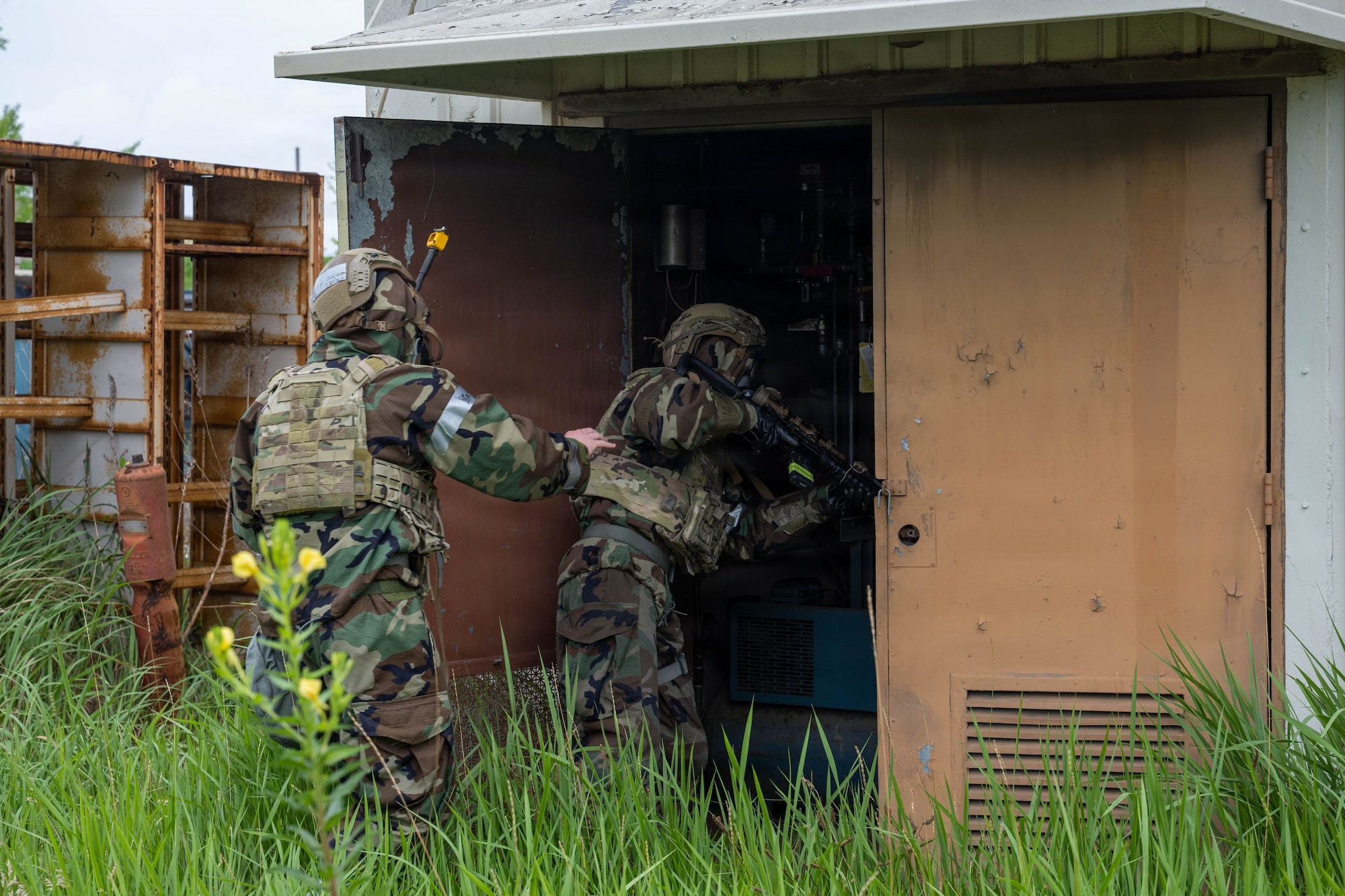 U.S. Air Force Airmen assigned to the 8th Fighter Wing perform a security sweep during an opposing force training scenario as part of exercise Beverly Sentinel 26-4 at Kunsan Air Base, Republic of Korea, July 22, 2026. This realistic training environment required personnel to adapt and overcome complex challenges, ensuring they are fully equipped to execute the mission under high-stress conditions. (U.S. Air Force photo by Senior Airman Tabatha Chapman)